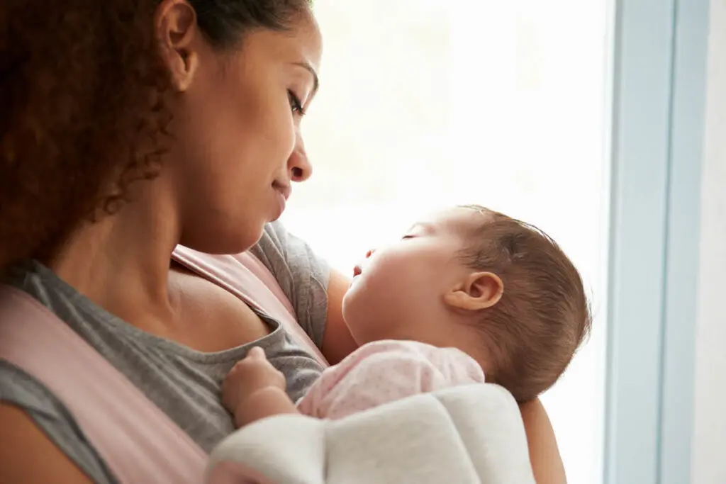 Mom holding young baby in her arms